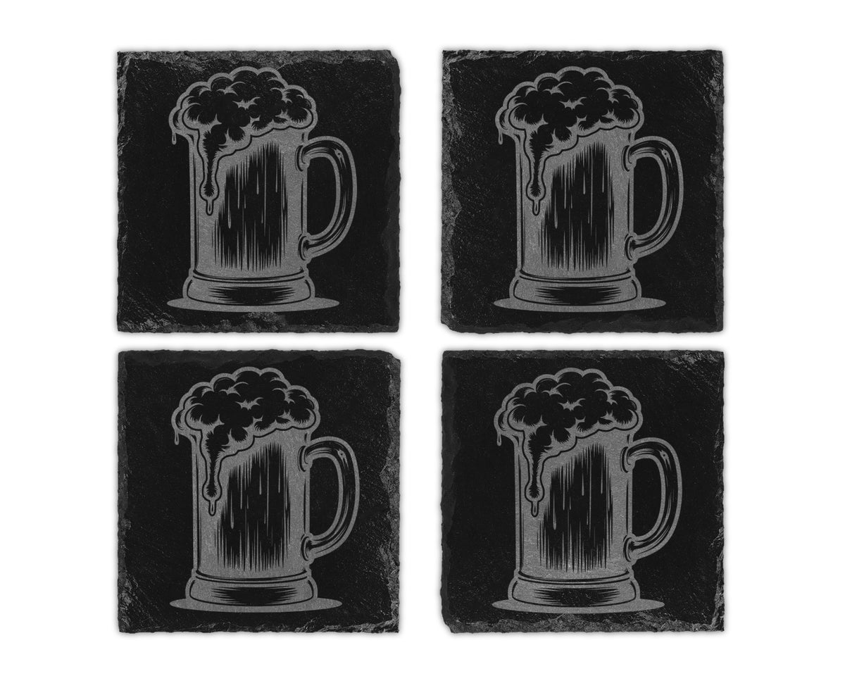 Four black slate coasters, each engraved with a beer mug overflowing with foamy beer.