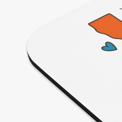 Orange California map outline with a blue heart on a white textured surface.