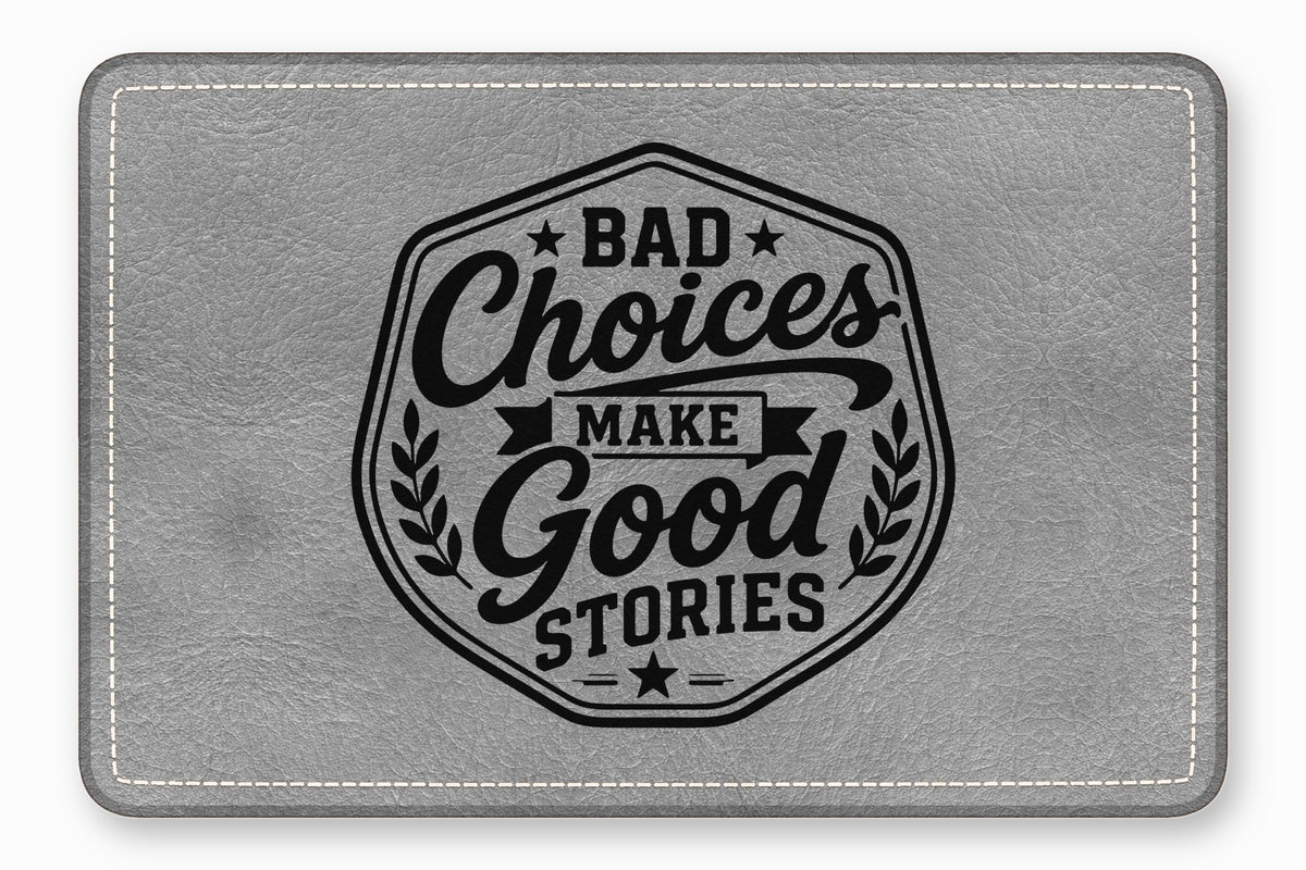 A gray faux leather patch with white stitching and the text BAD CHOICES MAKE GOOD STORIES.