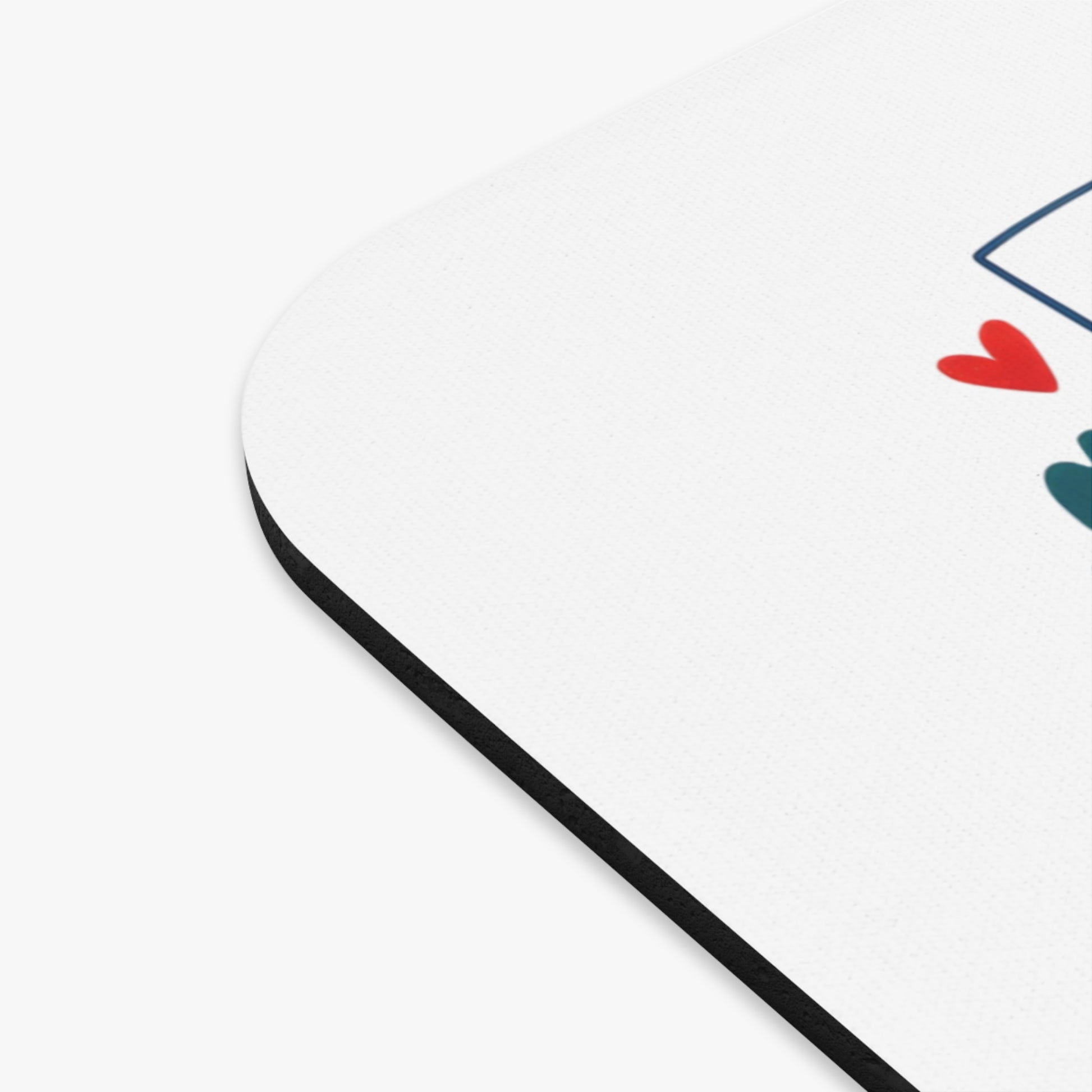 White mousepad with a blue house outline and red heart illustration.