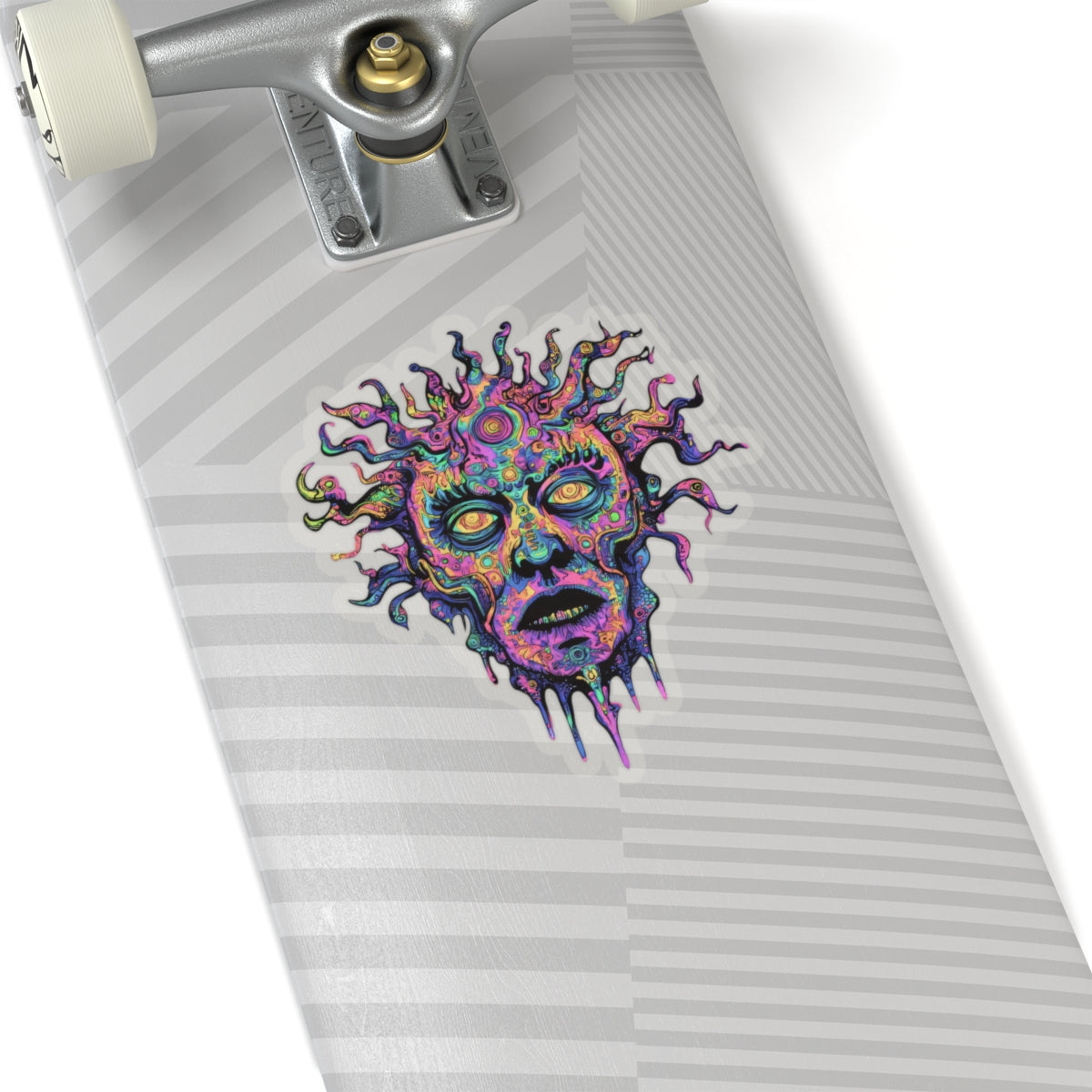 Psychedelic sun-faced sticker with distorted features on a skateboard deck.