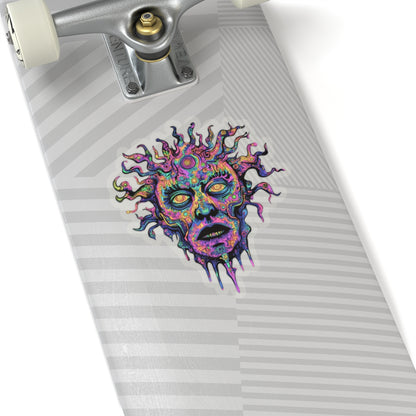 Psychedelic sun-faced sticker with distorted features on a skateboard deck.
