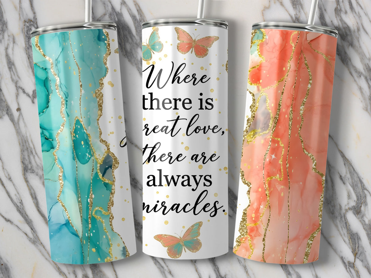 Three tumblers with marble patterns, gold glitter, and butterflies feature the text "Where there is great love, there are always miracles."