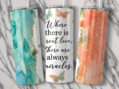 Three tumblers with marble patterns, gold glitter, and butterflies feature the text "Where there is great love, there are always miracles."