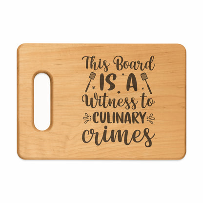 Wooden cutting board with engraved text "This Board IS A Witness to CULINARY crimes".