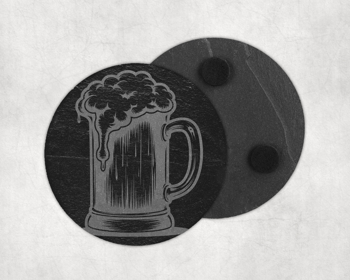 Slate coaster with engraved beer mug design and two black foam feet.