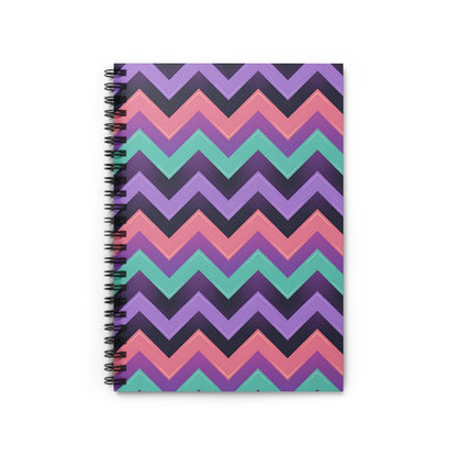 Spiral notebook with a purple, teal, pink, and dark grey chevron pattern.