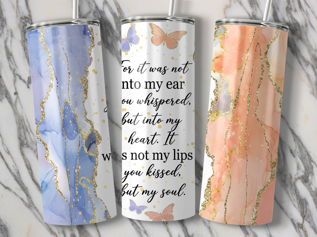 Three tumblers with marble and gold designs, one with quote and butterflies.