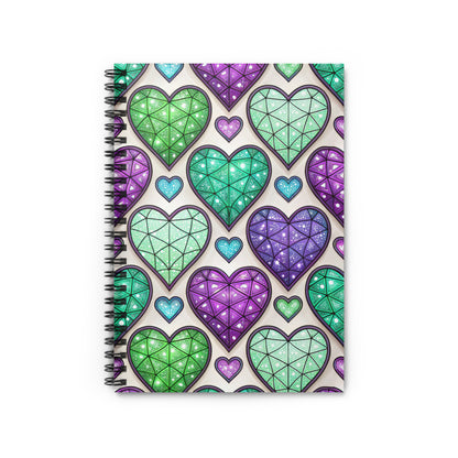 Spiral bound notebook with a pattern of colorful, faceted heart shapes.