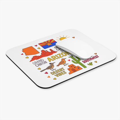 Mousepad with cartoon Arizona landmarks, sun, cacti, and desert animals.