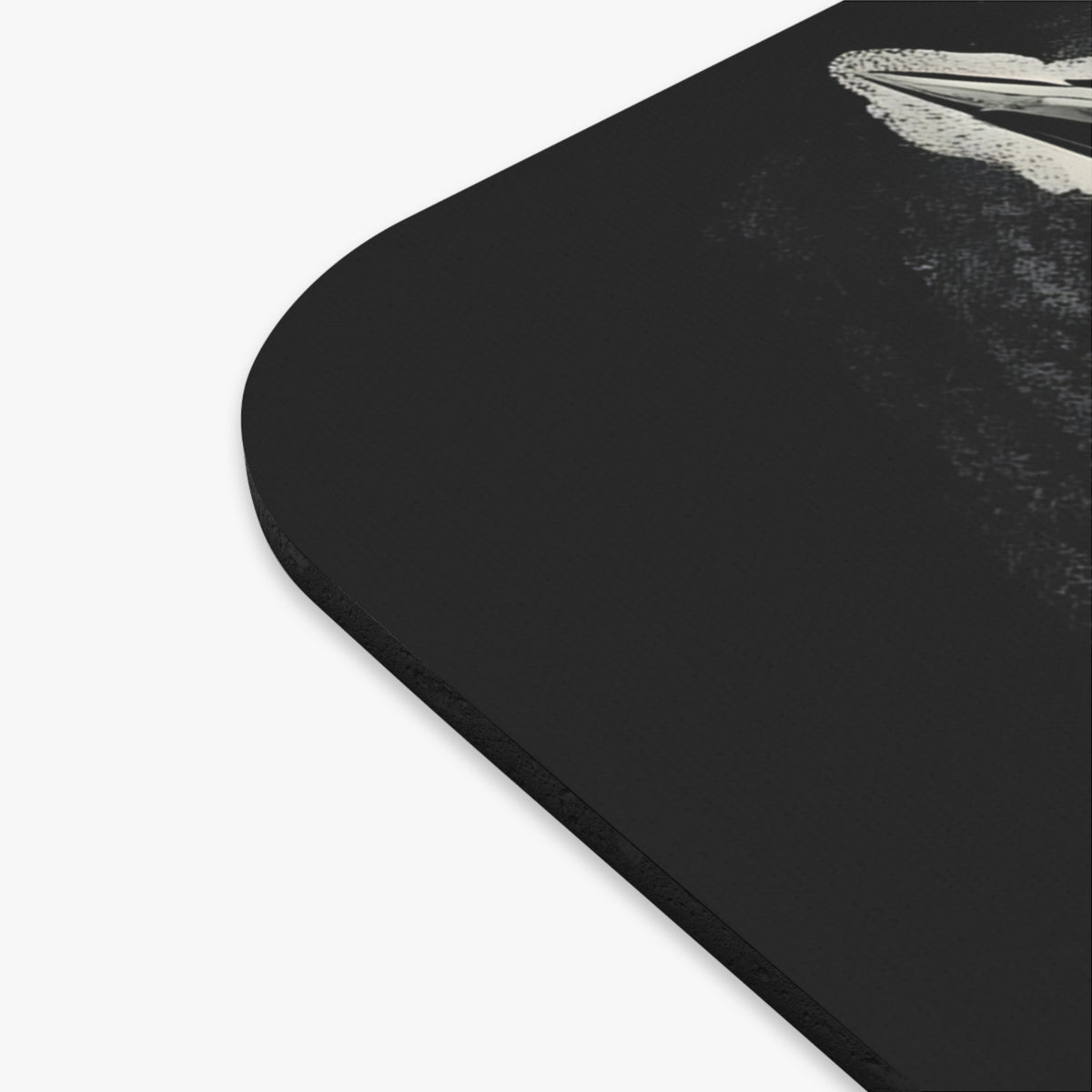 Black mousepad with a stylized abstract design featuring a white wave.