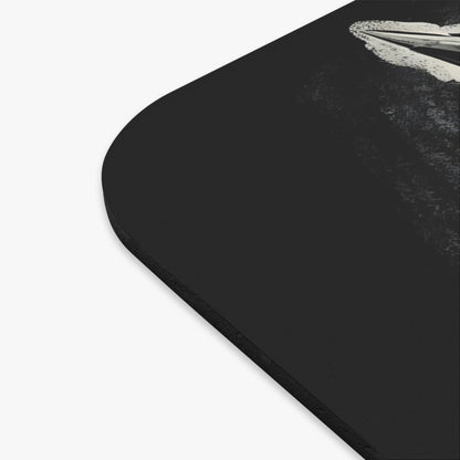 Black mousepad with a stylized abstract design featuring a white wave.