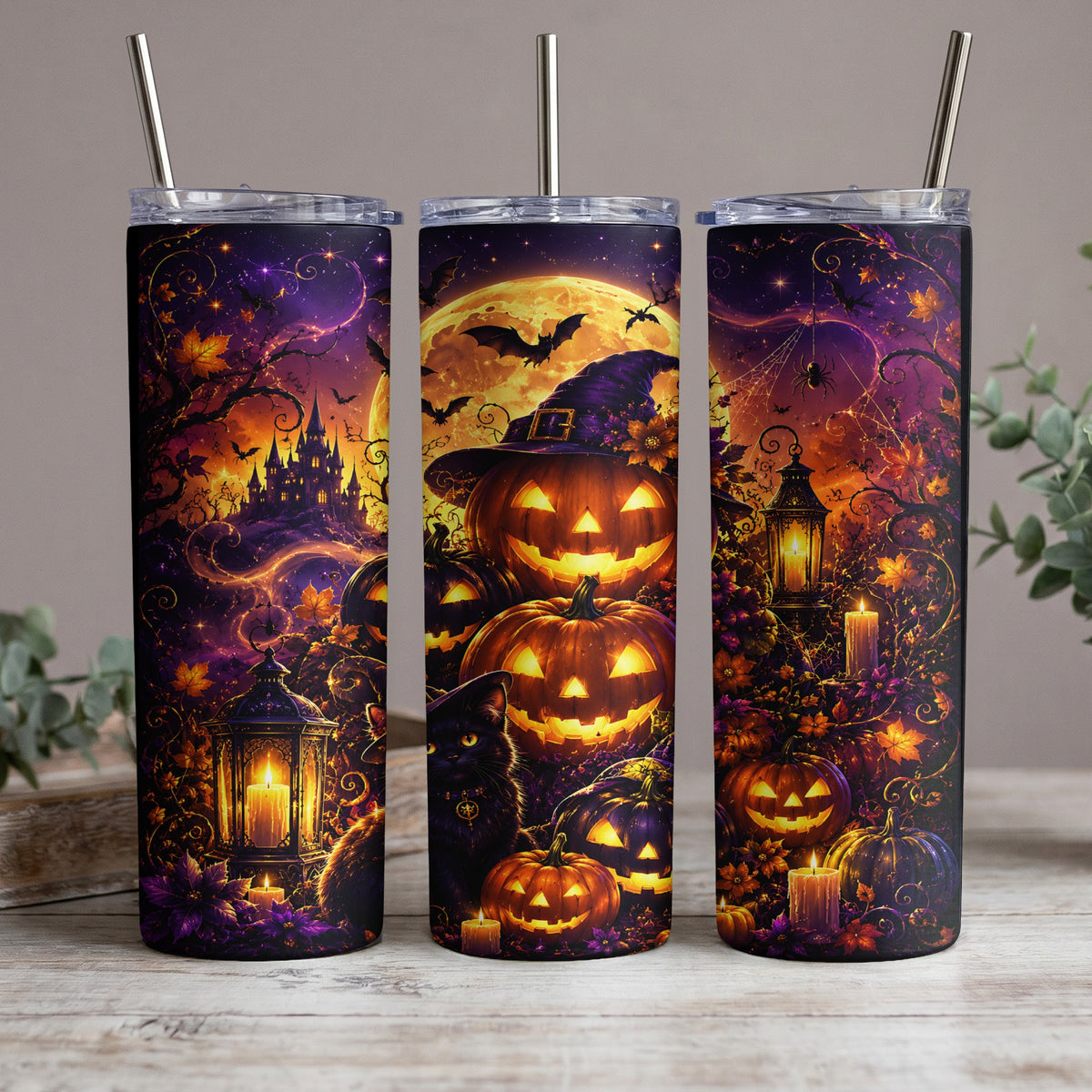 Halloween tumblers with pumpkins, a black cat, and a castle under a full moon.