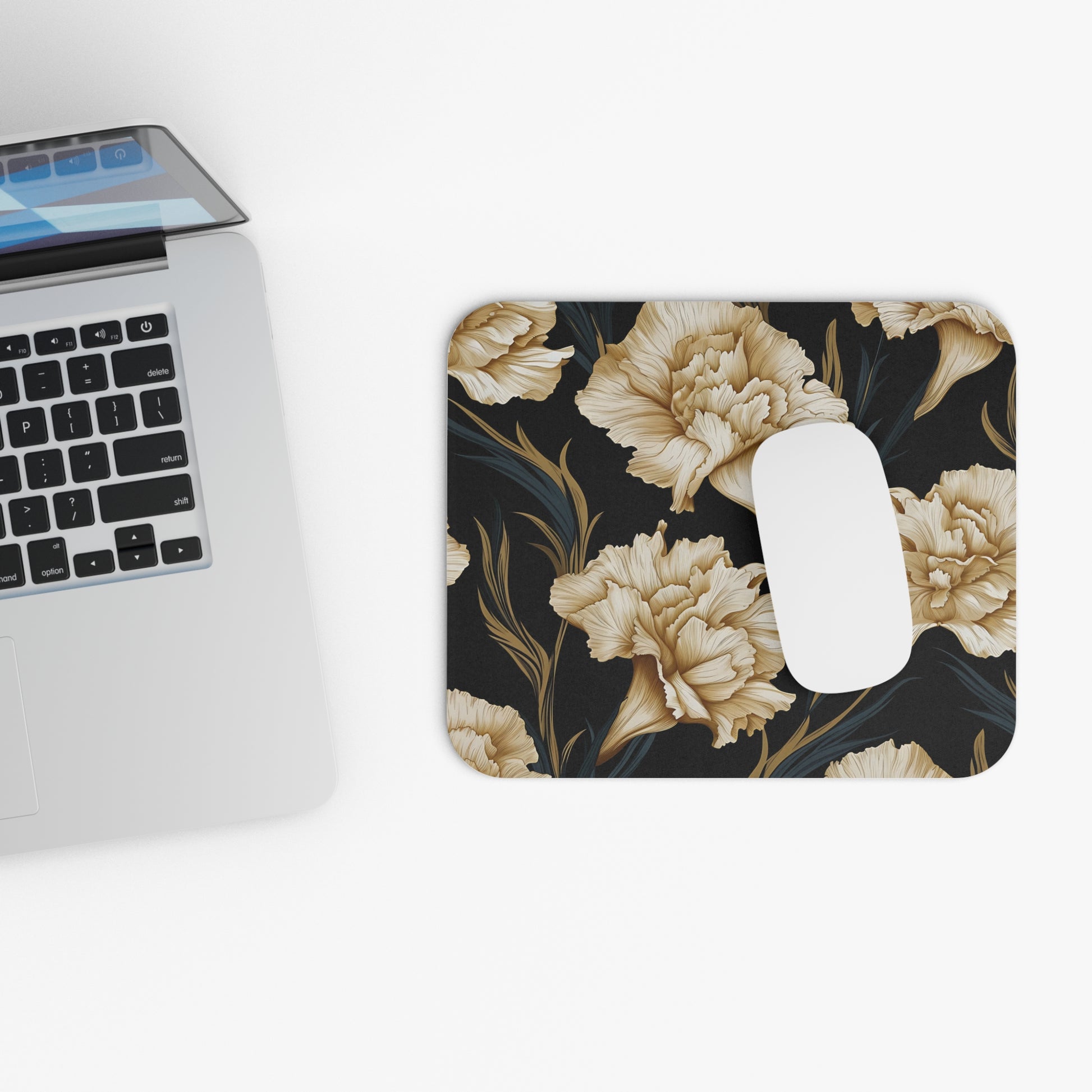 Mousepad with a dark background featuring a pattern of beige flowers and dark leaves.