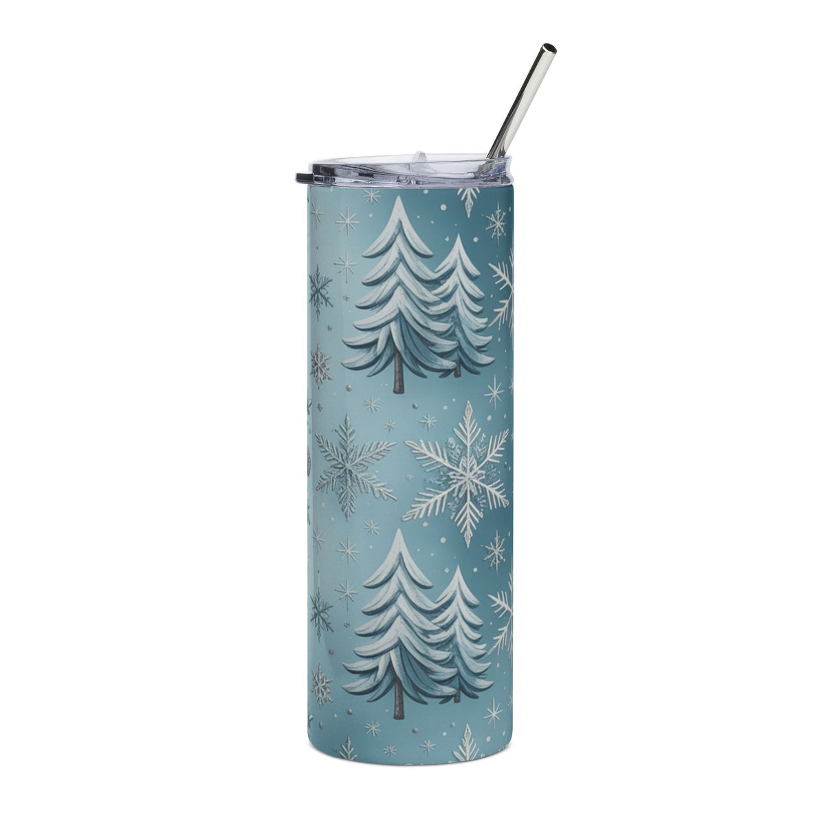 Blue tumbler with a winter forest and snowflake pattern and a metal straw.