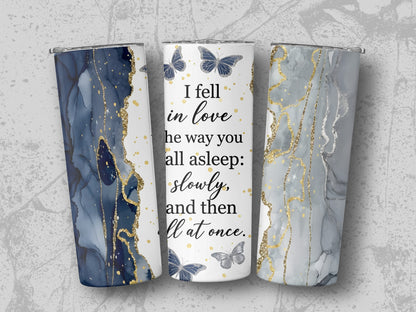 Tumblers with marbled blue, gray, and gold designs and "I fell in love" quote.