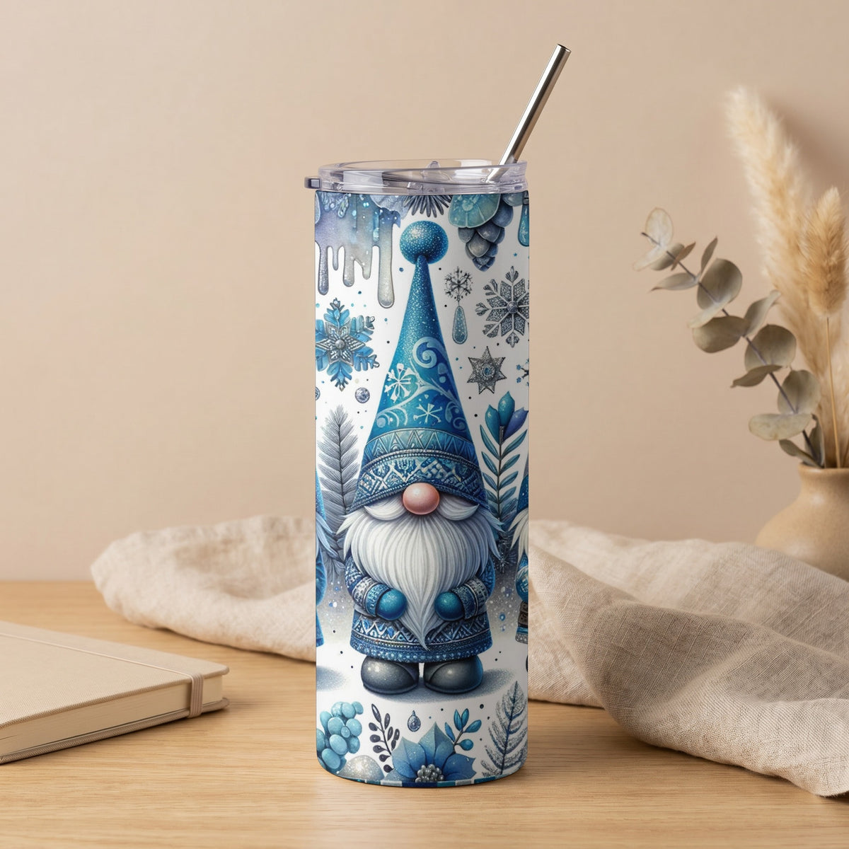 Blue gnome design on a white tumbler with a stainless steel straw and lid.