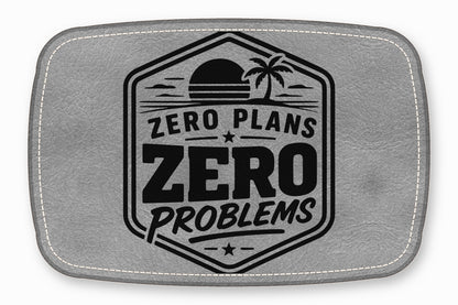 Gray leather patch with white stitched border and black stamped tropical design, featuring the text Zero Plans Zero Problems.