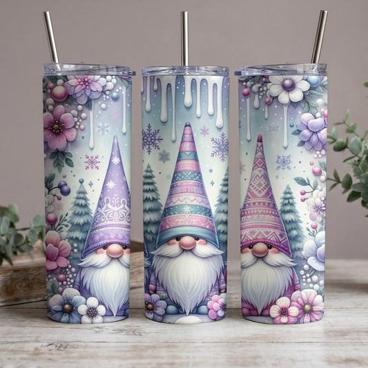 Three tumblers with watercolor gnomes, winter trees, and flowers designs.