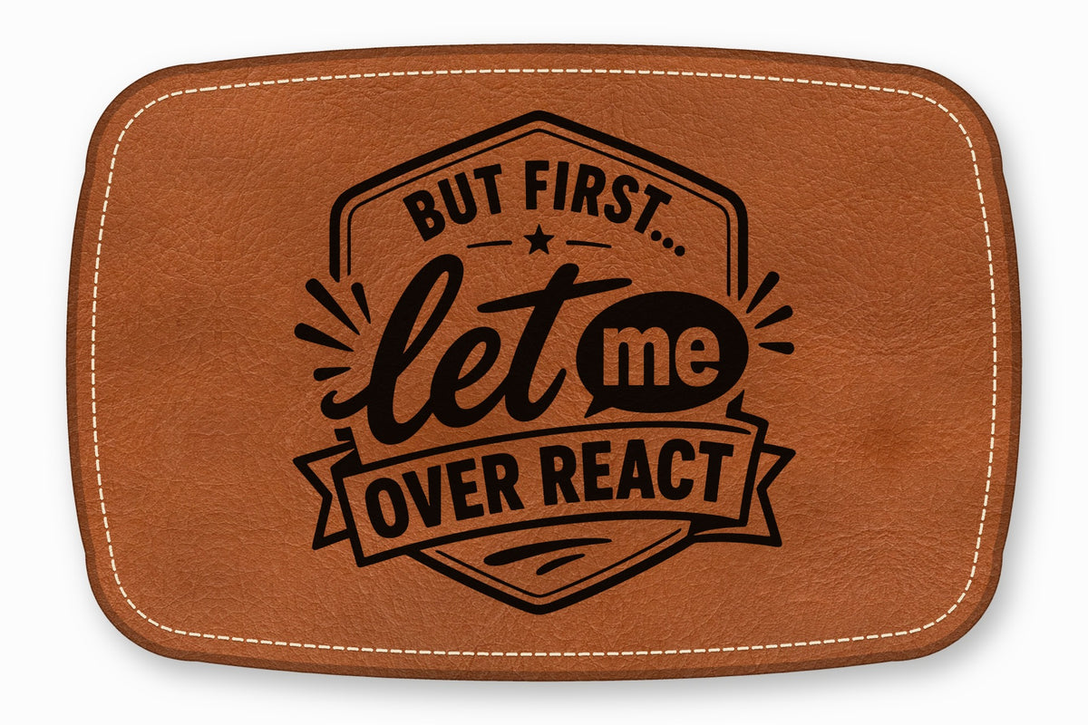 Brown leather patch with white stitched edges and black text that reads "But first... let me over react".