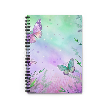 Spiral bound notebook with watercolor butterflies and floral accents on a purple and green background.
