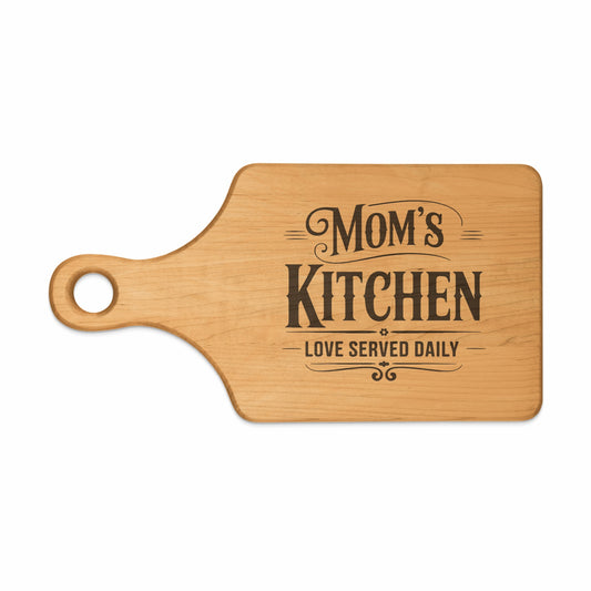 Wooden cutting board with text "Mom's Kitchen, Love Served Daily".