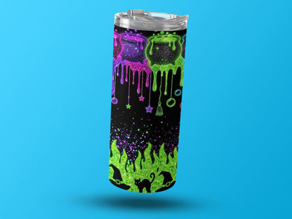 Tumbler with Halloween theme: cauldrons, black cat, witch hats, and stars.