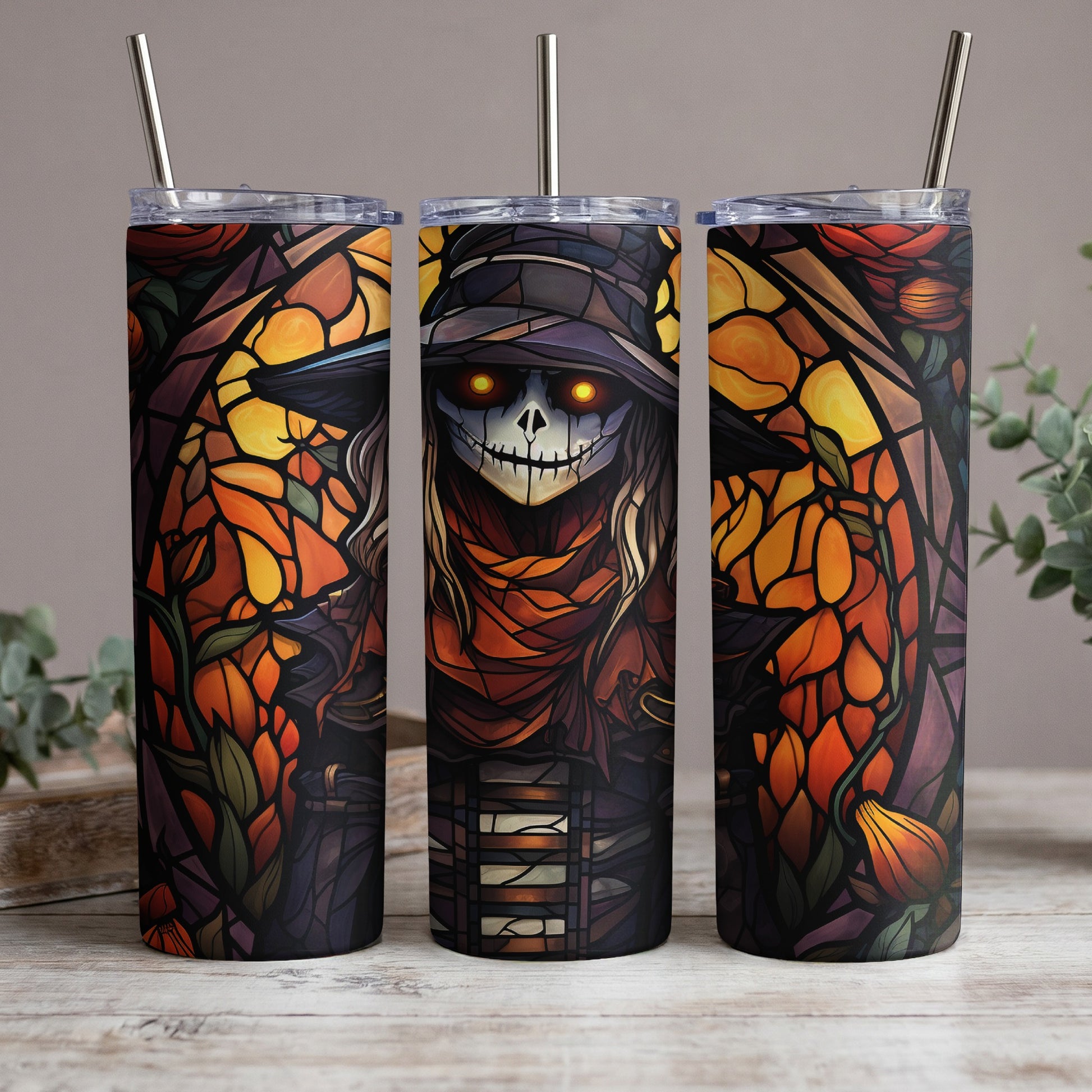 Three tumblers with a stained-glass scarecrow and pumpkin design.