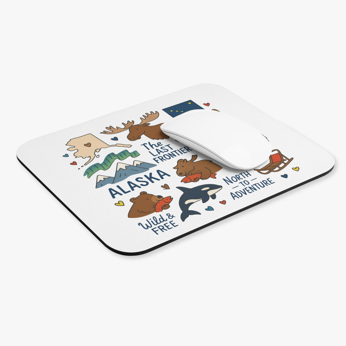 Alaska mousepad with illustrations of moose, bears, orcas, and mountains.