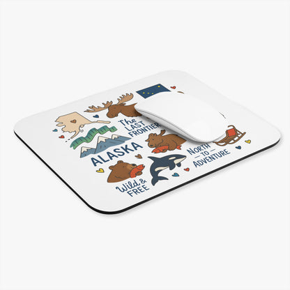 Alaska mousepad with illustrations of moose, bears, orcas, and mountains.
