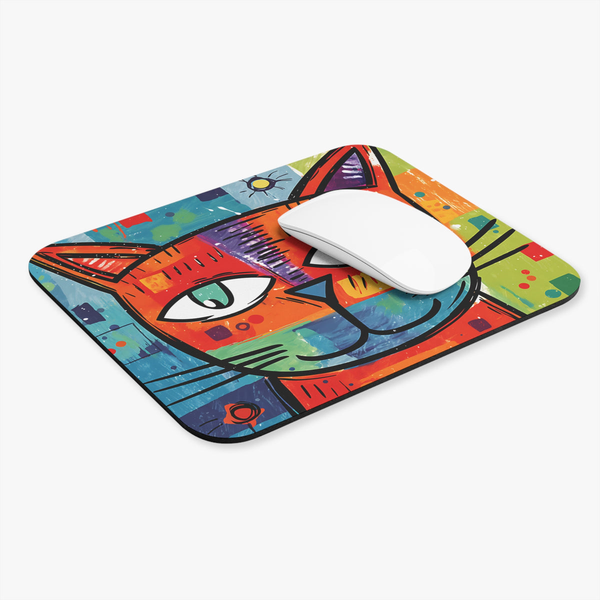 Mousepad with colorful abstract cat face and a white computer mouse.