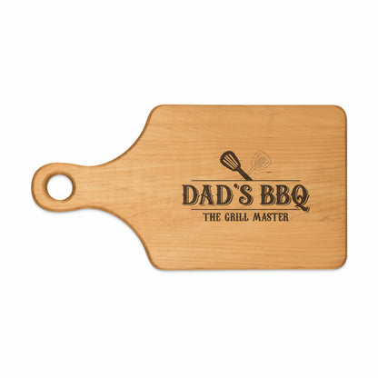 Wooden cutting board with "Dad's BBQ The Grill Master" text and grill utensils.