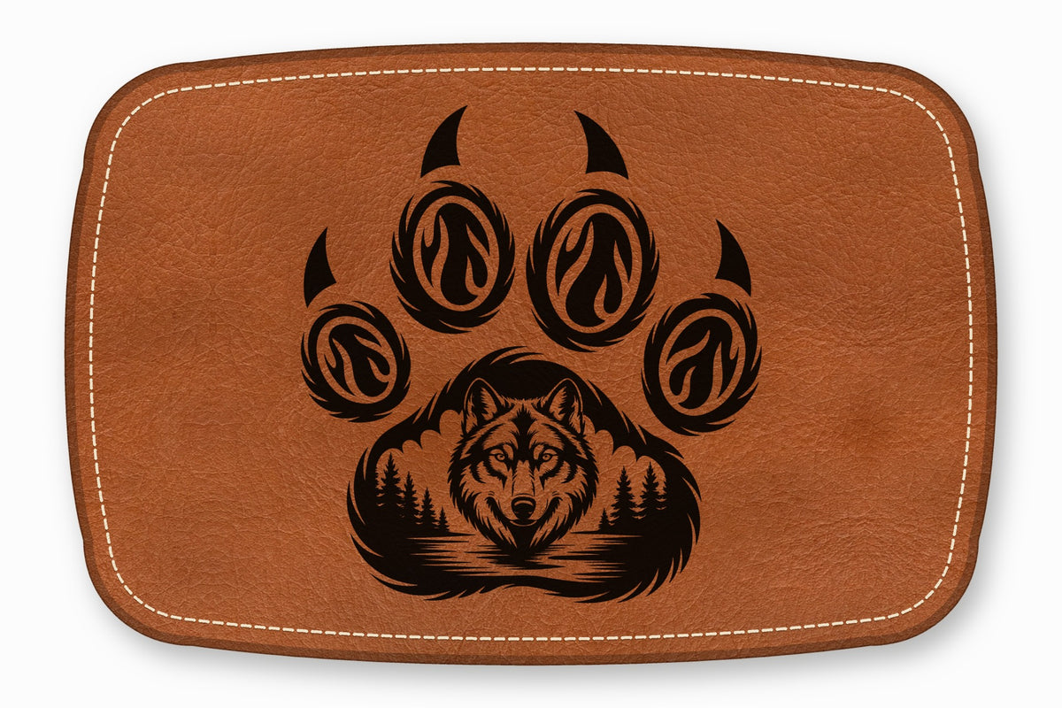 Brown leather patch with rounded corners, white stitching, and a black laser-engraved wolf in a paw print design.