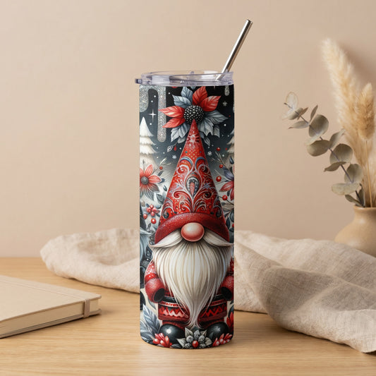 Tall tumbler featuring a gnome with a red hat, festive pattern, and a metallic straw.