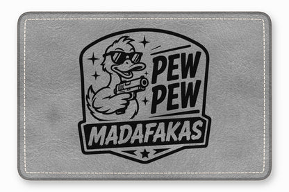 Gray leather mouse pad featuring a graphic of a duck with sunglasses holding a gun and the text PEW PEW MADAFAKAS.
