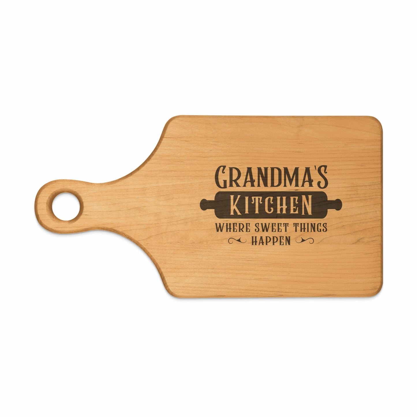 Wooden cutting board with "Grandma's Kitchen Where Sweet Things Happen" text and rolling pin graphic.