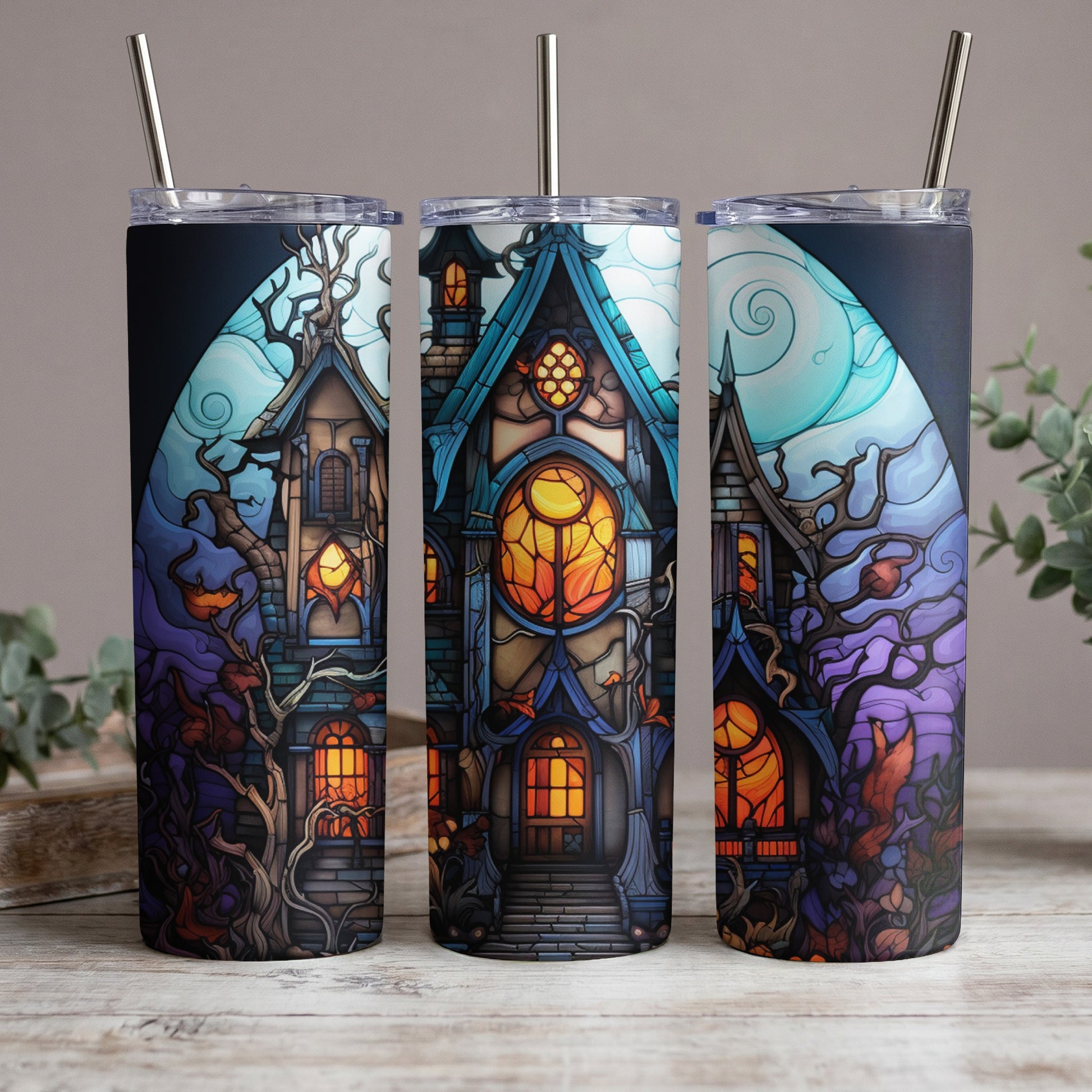 Three tumblers display a spooky haunted house with glowing orange windows and bare trees.
