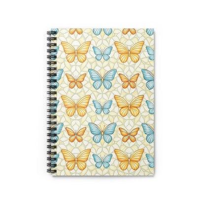 Spiral bound notebook with a pattern of orange and blue butterflies on a yellow background.