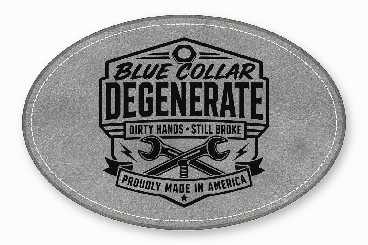 Oval gray leather patch with white stitched border and black printed graphic of crossed wrenches and text.