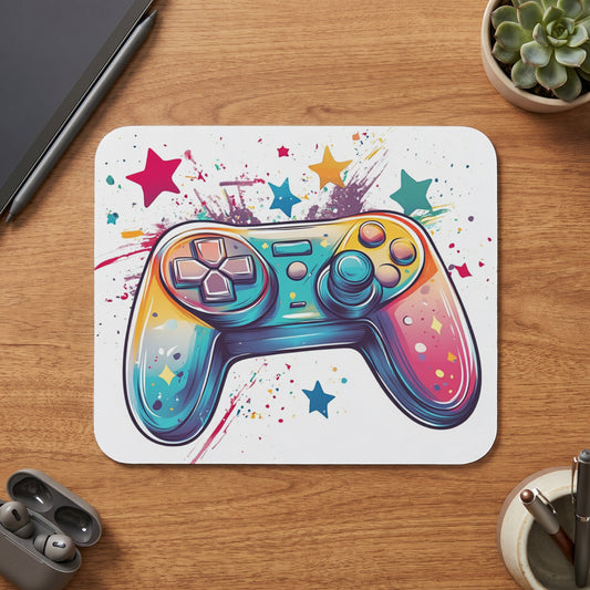 Colorful video game controller with stars and paint splatters on a white surface.