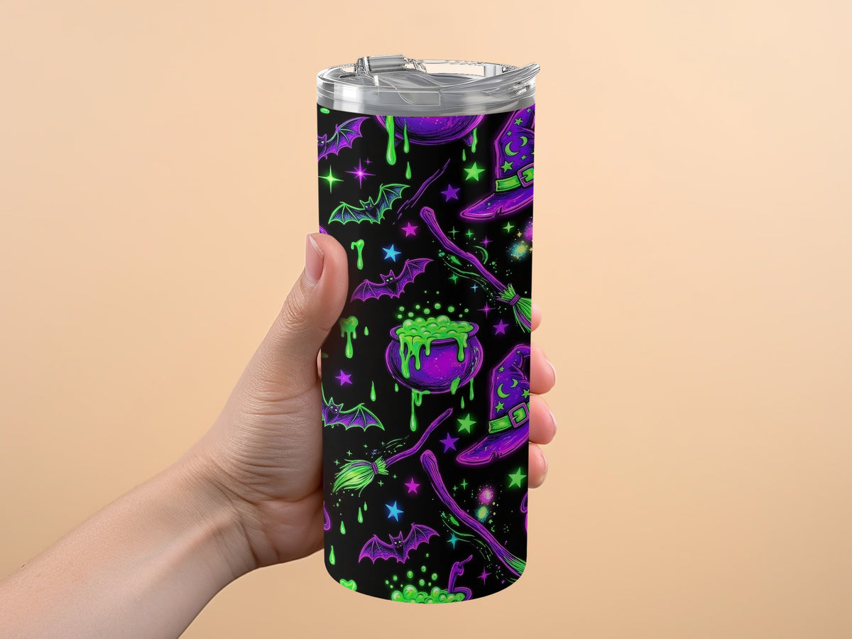 Halloween tumbler with bats, cauldrons, witch hats, and brooms.