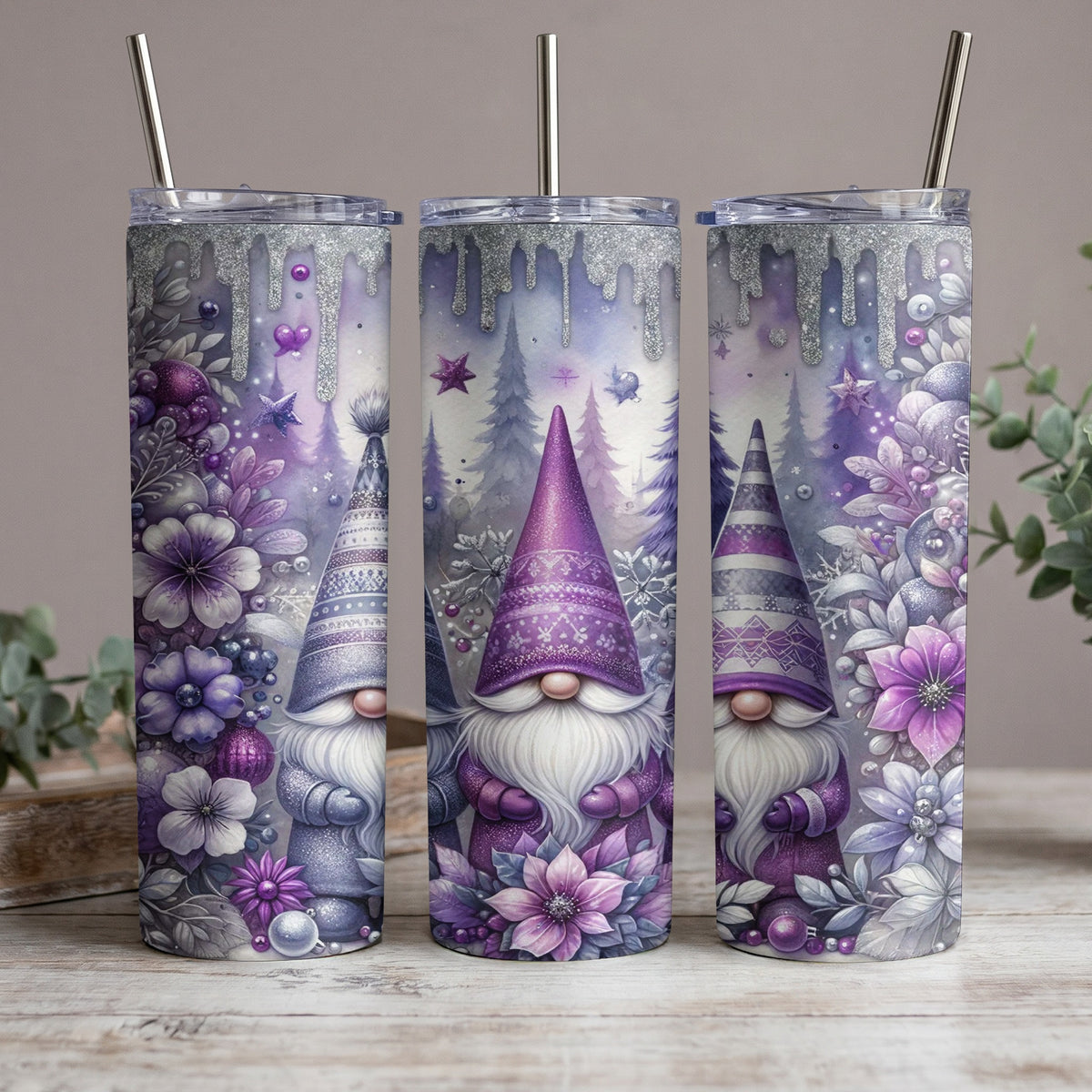 Three purple gnomes with winter floral and forest designs on tumblers.