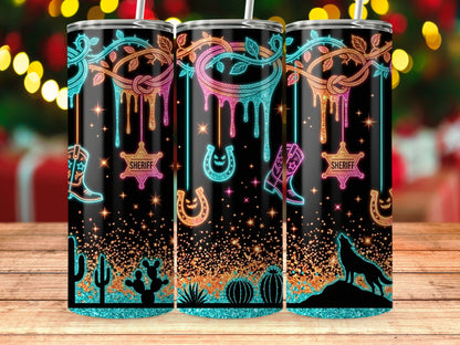 Three tumblers with western and spooky designs, including cowboys, sheriffs, and wolves.