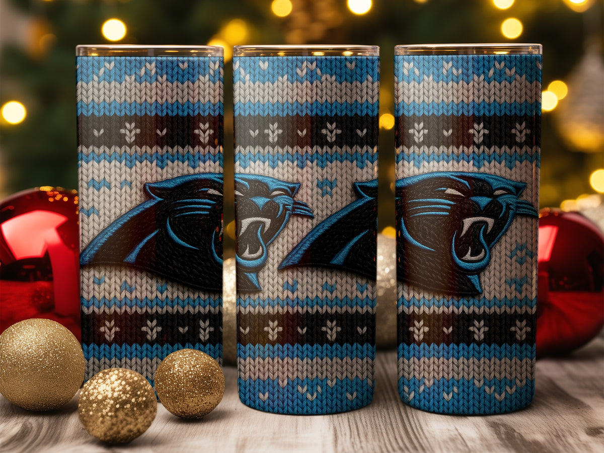 Three tumblers with a knitted pattern and Carolina Panthers logo, displayed with Christmas ornaments.