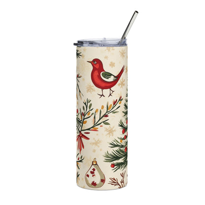 Cream tumbler with red bird, pine branches, ornaments, and snowflakes pattern.