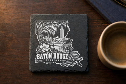 Square black slate coaster engraved with a detailed Baton Rouge, Louisiana skyline and map outline.