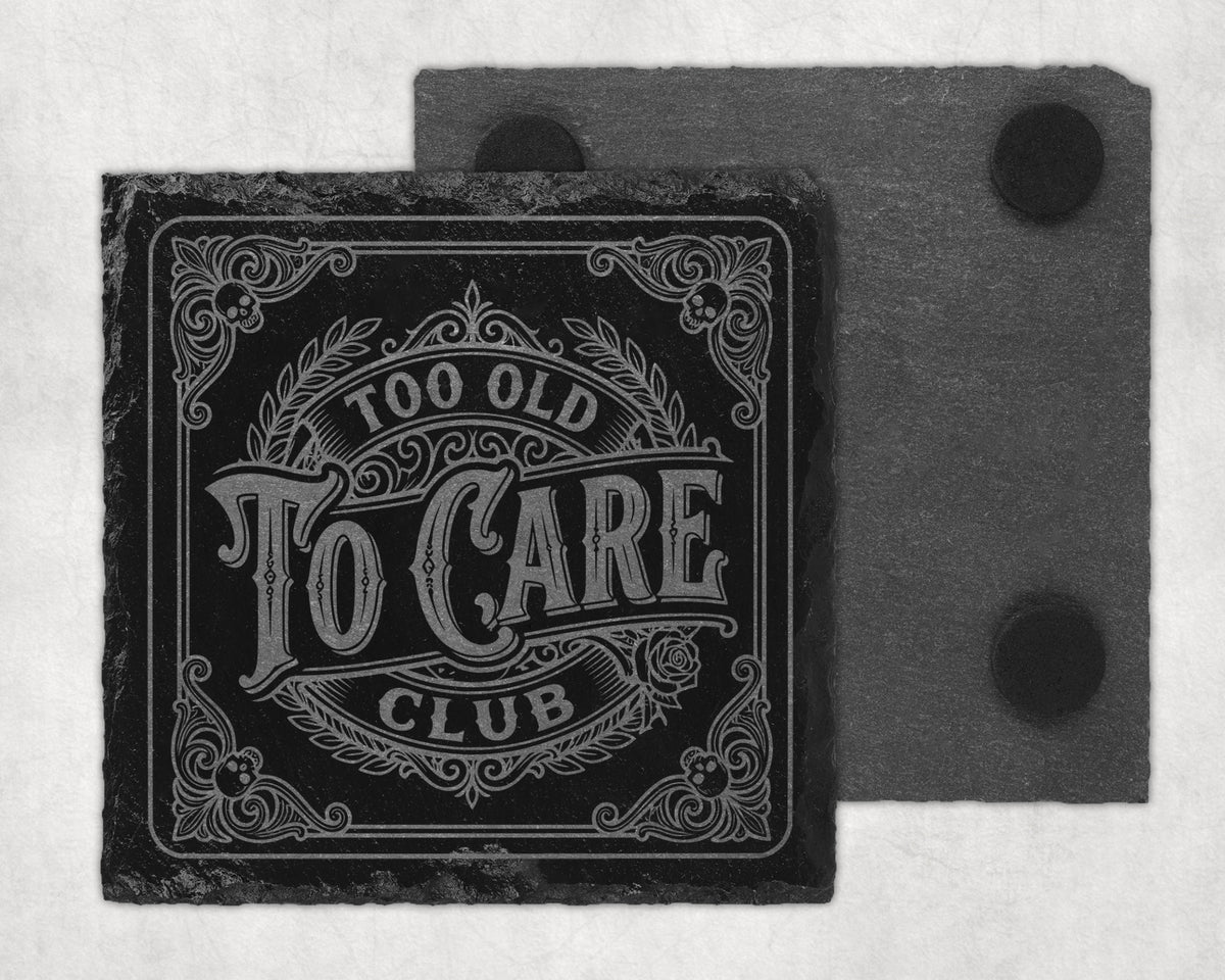Square slate coaster with etched text "Too Old To Care Club" and decorative border.