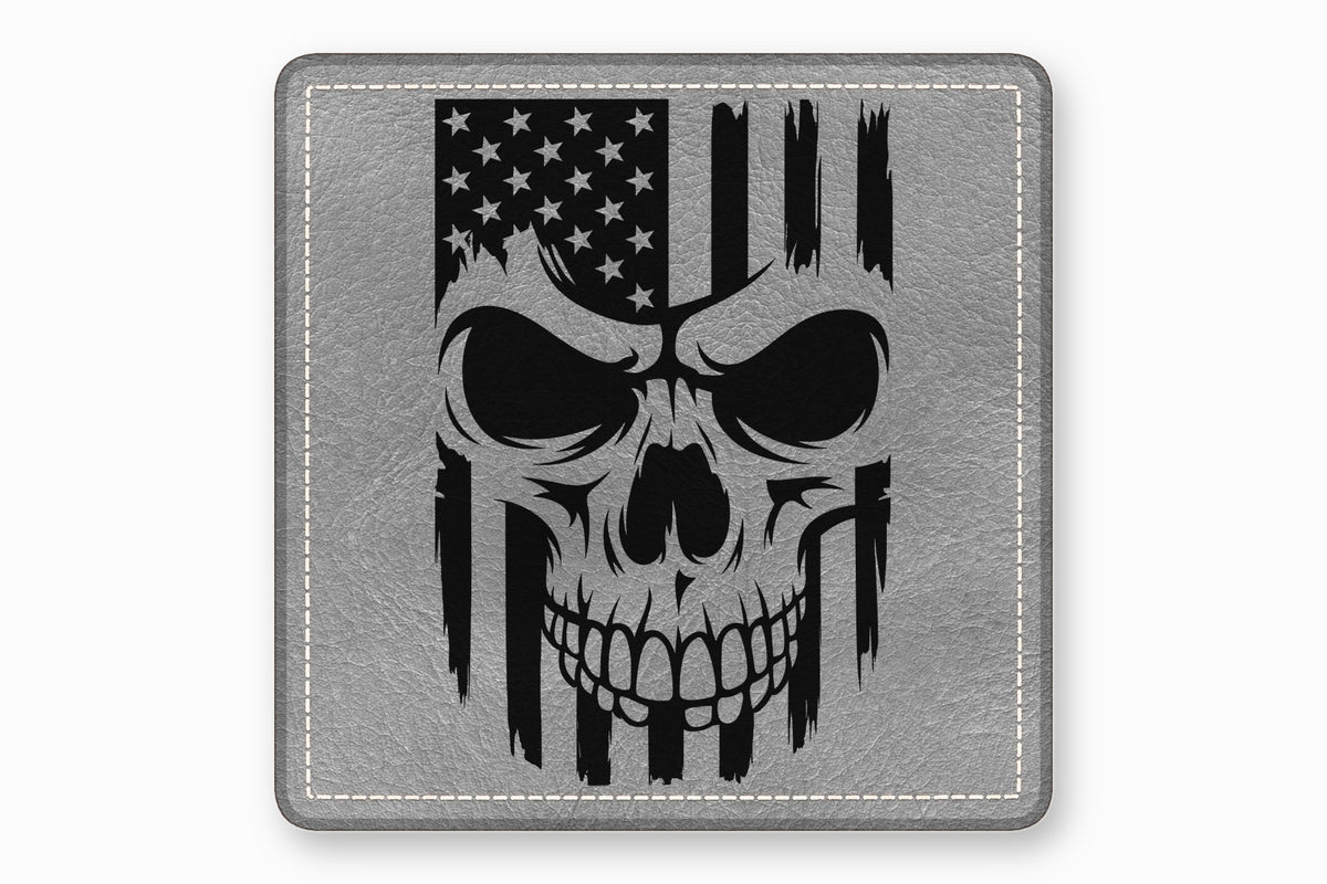 Square grey leather patch with rounded corners, featuring a black distressed skull and American flag design.