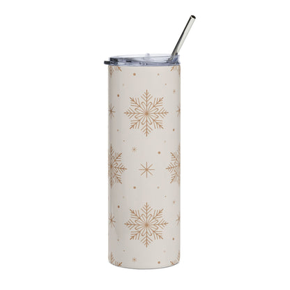 Cream tumbler with gold snowflake pattern and silver straw.