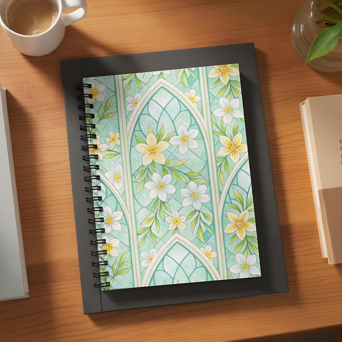 Spiral notebook with a mint green floral stained glass design.